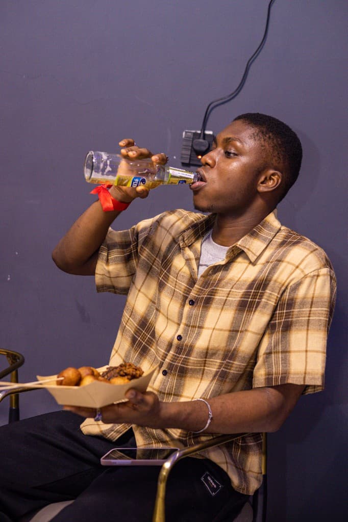 Guest enjoying snacks and a drink at Cafeteria Games Night